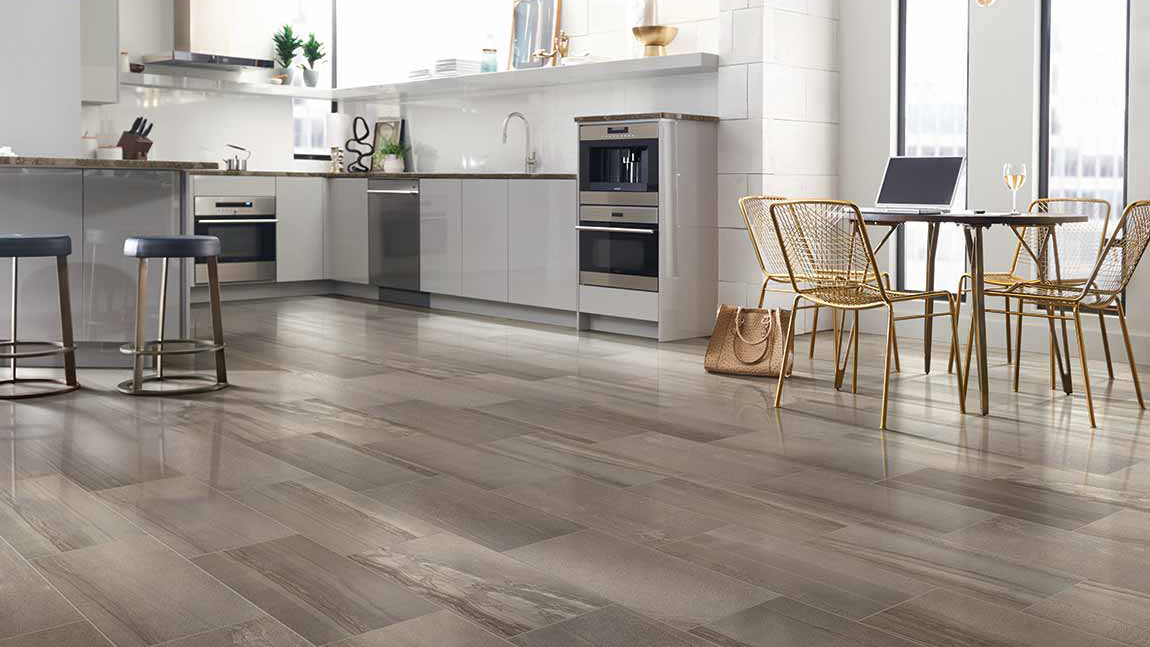 Tile flooring in a kitchen, installation services available.